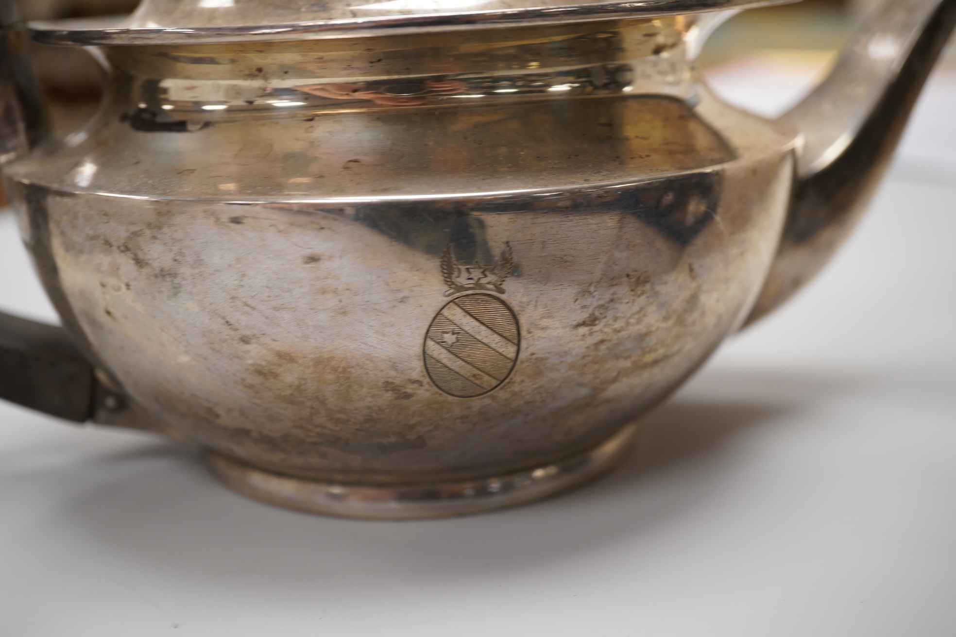 Assorted silver including a George V silver teapot by James Dixon & Sons, Sheffield, 1925, gross weight 25.6oz, an Edwardian silver sauceboat, a near pair of modern silver candlesticks, a silver matchbox holder, a pair o